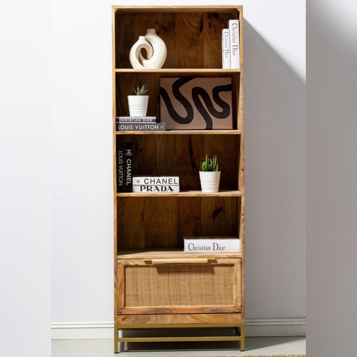 Vandana Merino Sereno Rattan Mango Wood Bookcase Shelves with Gold Base Modern Storage Design Vandana Merino Sereno Rattan Mango Wood Bookcase Shelves with Gold Base Modern Storage Design