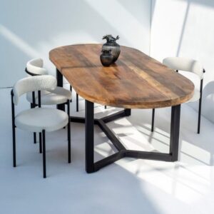 Vandana Zentrix Vertex – Oval Mango Wood Dining Table Introduce timeless elegance and natural charm into your dining space with the Vandana Zentrix Vertex, a beautifully crafted oval dining table made from premium solid mango wood. Designed to be both stylish and functional, this table brings together the organic warmth of real wood and the refined sophistication of its smooth, elongated oval silhouette. The generous 220 cm length provides ample seating, making it perfect for everyday dining, weekend gatherings, or hosting special occasions with family and friends. The rich, distinctive grain patterns of mango wood take center stage in the Vertex dining table. Each piece is hand-finished to enhance its natural texture and earthy tone, ensuring that every table has its own unique character. The elegant oval top softens the overall look, allowing for better flow and movement around the table—ideal for modern homes, open layouts, and spaces where comfort and style are equally important. Built with long-lasting durability in mind, the sturdy construction delivers exceptional stability and strength. Its one-piece design offers added convenience, arriving fully assembled and ready to use immediately upon delivery. The Vertex blends seamlessly with a variety of interior themes, including contemporary, Scandinavian, rustic, transitional, and modern organic styles. Whether paired with wooden, upholstered, or mixed-material dining chairs, this table creates a harmonious and inviting dining environment. Crafted for those who value quality, aesthetics, and practicality, the Vandana Zentrix Vertex stands as a refined centerpiece that elevates your dining experience. From casual meals to formal dinners, its spacious design, natural beauty, and artisanal craftsmanship ensure it remains a cherished part of your home for years to come. Product Details: • Dimensions: 220CM Length x 100CM Depth x 75CM Height • Material: 100% Solid Mango Wood • Installation: Delivered as one complete piece; no assembly required