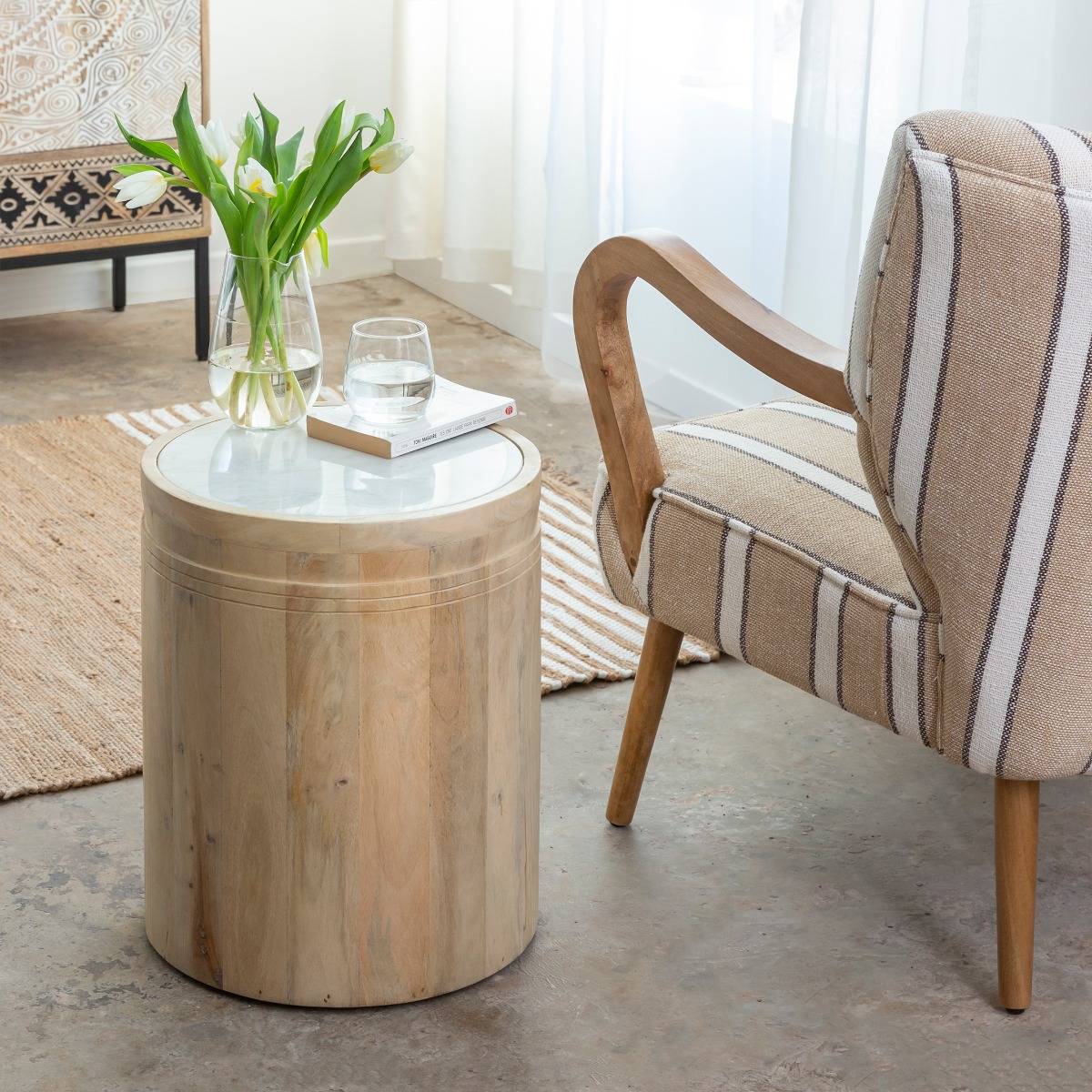 Vandana Aston Hexa – Moana Mango Wood & White Marble Side Table | Contemporary Accent Furniture The Vandana Aston Hexa – Moana Side Table is a refined blend of natural elegance, compact functionality, and contemporary design, created to elevate modern interiors with subtle sophistication. Designed as a versatile accent piece, this side table effortlessly complements living rooms, bedrooms, lounges, boutique hotels, and premium hospitality spaces. Crafted with a solid mango wood base and topped with genuine white marble, this table represents a harmonious contrast between warm organic textures and cool natural stone. Mango wood is highly regarded for its strength, durability, and eco-conscious sourcing, while white marble adds a timeless, luxurious appeal that enhances the overall aesthetic value of the piece. With its compact dimensions of 38 × 38 cm and a height of 46 cm, the Moana side table is ideal for use as a sofa side table, bedside table, accent stand, or decorative pedestal. Despite its small footprint, it offers excellent surface space for placing lamps, books, décor objects, or everyday essentials, making it both practical and stylish. Each marble top is naturally unique, featuring individual veining patterns, subtle tonal variations, and organic markings that make every piece one of a kind. These natural characteristics are a hallmark of authentic marble and add to the table’s exclusive, handcrafted charm. The clean lines and minimalist form allow this table to blend seamlessly with contemporary, modern, Scandinavian, Japandi, and luxury interiors. Its light color palette ensures compatibility with a wide range of furniture styles and color schemes. Delivered fully assembled, the Moana side table is designed for immediate use and long-term stability. The marble top simply rests securely on the wooden frame, allowing for easy placement and repositioning. Lightweight yet sturdy, it can be moved effortlessly from room to room, adapting to changing décor needs. The Vandana Aston Hexa – Moana Side Table is more than just a small furniture piece—it is a carefully designed accent that adds balance, elegance, and refinement to any space. Perfect for both residential and export markets, it meets the expectations of customers seeking premium materials, timeless design, and everyday functionality. Vandana Aston Hexa – Moana Mango Wood & White Marble Side Table | Contemporary Accent Furniture The Vandana Aston Hexa – Moana Side Table is a refined blend of natural elegance, compact functionality, and contemporary design, created to elevate modern interiors with subtle sophistication. Designed as a versatile accent piece, this side table effortlessly complements living rooms, bedrooms, lounges, boutique hotels, and premium hospitality spaces. Crafted with a solid mango wood base and topped with genuine white marble, this table represents a harmonious contrast between warm organic textures and cool natural stone. Mango wood is highly regarded for its strength, durability, and eco-conscious sourcing, while white marble adds a timeless, luxurious appeal that enhances the overall aesthetic value of the piece. With its compact dimensions of 38 × 38 cm and a height of 46 cm, the Moana side table is ideal for use as a sofa side table, bedside table, accent stand, or decorative pedestal. Despite its small footprint, it offers excellent surface space for placing lamps, books, décor objects, or everyday essentials, making it both practical and stylish. Each marble top is naturally unique, featuring individual veining patterns, subtle tonal variations, and organic markings that make every piece one of a kind. These natural characteristics are a hallmark of authentic marble and add to the table’s exclusive, handcrafted charm. The clean lines and minimalist form allow this table to blend seamlessly with contemporary, modern, Scandinavian, Japandi, and luxury interiors. Its light color palette ensures compatibility with a wide range of furniture styles and color schemes. Delivered fully assembled, the Moana side table is designed for immediate use and long-term stability. The marble top simply rests securely on the wooden frame, allowing for easy placement and repositioning. Lightweight yet sturdy, it can be moved effortlessly from room to room, adapting to changing décor needs. The Vandana Aston Hexa – Moana Side Table is more than just a small furniture piece—it is a carefully designed accent that adds balance, elegance, and refinement to any space. Perfect for both residential and export markets, it meets the expectations of customers seeking premium materials, timeless design, and everyday functionality.