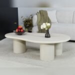 Vandana Silver Comfort organic-shaped coffee table in cream-tinted micro-cement